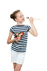 Cute smiling little girl with with sushi on  white background.