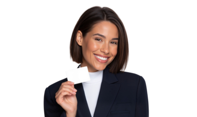 Cheerful young businesswoman smiles warmly while holding up a blank white card, ready for your custom message