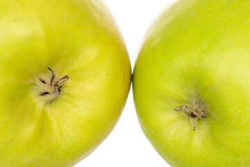 Green juicy apples isolated on white background, close-up.