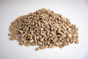 shelled sunflower seeds on a white background