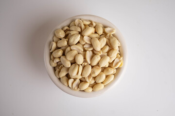 raw shelled peanuts in the bowl