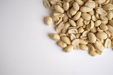 raw shelled peanuts on white background