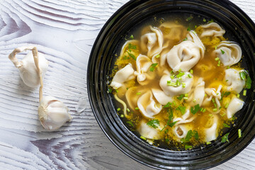 Close-Up of Molo Soup in a Black Bowl – Traditional Filipino Dish
