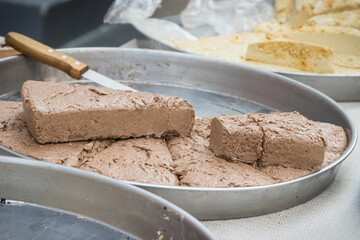 Halva with cocoa on stall at bazaar. High calorie snack
