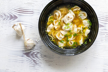 Close-Up of Molo Soup in a Black Bowl – Traditional Filipino Dish
