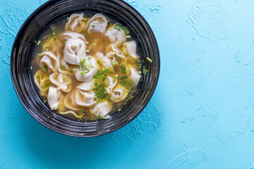 Close-Up of Molo Soup in a Black Bowl – Traditional Filipino Dish
