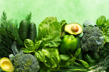 A vibrant collection of fresh green vegetables and herbs fills the scene, showcasing broccoli, cucumbers, lettuce, avocado, and various herbs like basil and dill, healthy eating