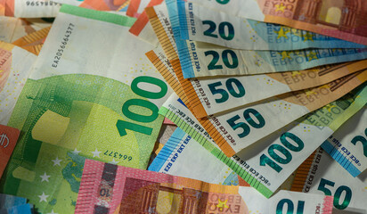 Financial background of scattered euro banknotes