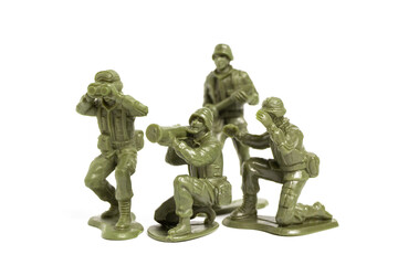 Mini Green Toy Soldiers on white background.