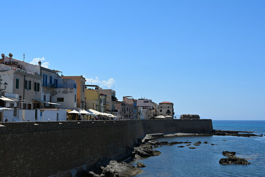 Cityscape of historical part of Alghero town. Waterfront of Alghero town in Sardinia. Alghero old town, street view, Sardinia, Italy