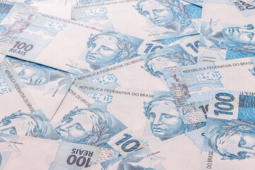 Obraz premium 100 Brazilian real banknotes, one hundred real notes, Brazilian money, background, texture