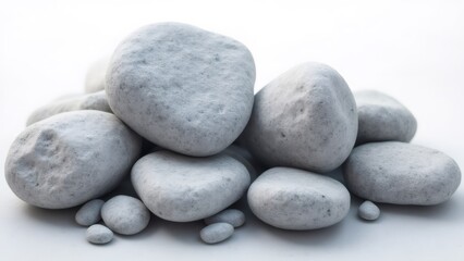 Smooth White Stones Pile on Neutral Backdrop, Outdoor Setting, Daytime