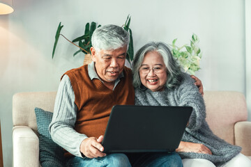 Happy Senior Couple Using Laptop at Home Living Room Showing Retirement Lifestyle, Digital Communication, Technology Bonding, Online Connection, and Positive Relationship