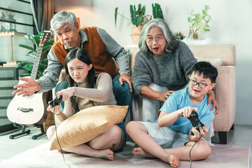 Multi Generational Family Playing Video Game in Modern Home Living Room Creating Joyful Bonding, Togetherness, Digital Entertainment, and Shared Happiness