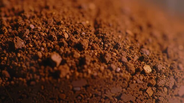 Rich, dark brown soil or dirt clods texture close-up detail shot