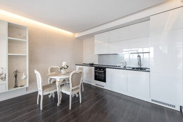 Modern Home Minimalist Kitchen Interior With Elegant Dining Table in Bright Interior.