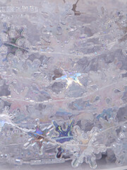 Christmas background made of pearlescent thread with large snowflakes