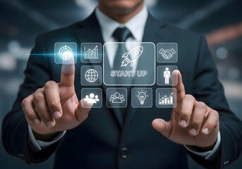 Man in suit interacting with digital interface showing startup and business related icons displayed