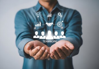 Man presenting teamwork concept with virtual icons in his hands against gray background view close up