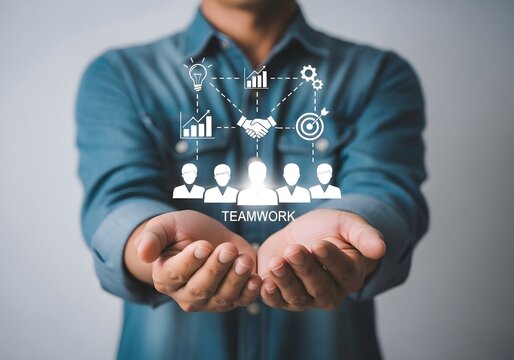Man presenting teamwork concept with virtual icons in his hands against gray background view close up - Powered by Adobe