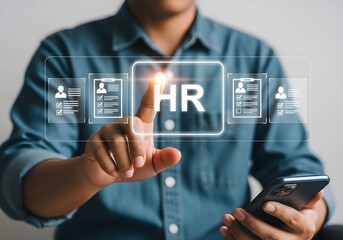 A person interacts with a digital hr interface on a transparent screen while holding a smartphone