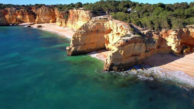  Best scenic becahes of Algarve coast, Portugal. Breathtaking scenic rocks of Praia da Marinha. Aerial drone 4k hd video.
