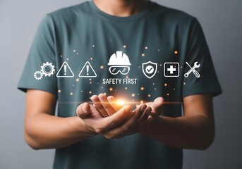 Person holding safety icons with safety first text and light effect in palms of their hands