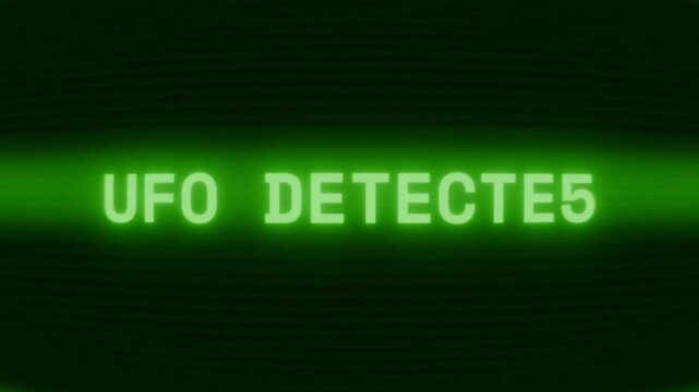 Old green CRT screen showing text UFO DETECTED appearing in random glitch and coding style