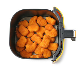 Air fryer basket with chicken nuggets isolated on white, top view