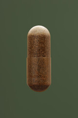 Natural food supplement in a capsule on a green background.