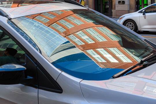 Colonial architecture reflection in windshield of car, Toronto, Canada