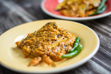 Spicy pabda fish curry gravy.
