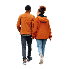Couple walks hand in hand in casual fall attire during a cool day