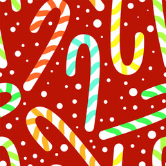 Seamless pattern of Christmas multicolored sugar canes with snow on a red background