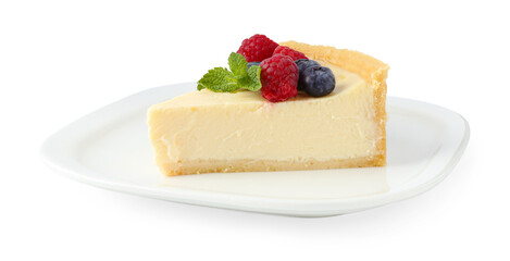 Piece of delicious cheesecake with fresh berries and mint isolated on white