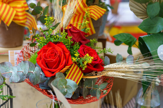 Red rose with an ear of wheat, Sant Jordi celebration on April 23rd in Catalonia, Spain.