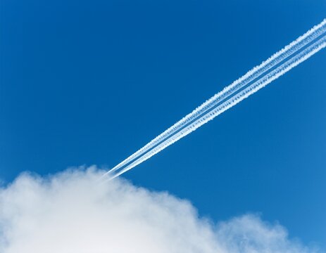 travel design backdrop horisontal aircraft contrail against clear blue sky