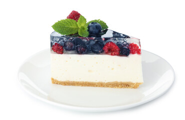 Piece of delicious cheesecake with berries and mint isolated on white