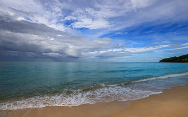 Beach with a cloudy sky in the background