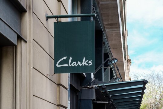 Barcelona, Spain-April 24, 2023. Clarks, international footwear manufacturer and retailer. Founded in 1825 by brothers Cyrus and James Clark in Street, Somerset, England. Sign on the front door