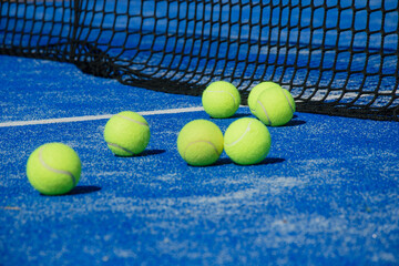 Padel Balls Scattered on a Blue Court The Concept of a Finished Game