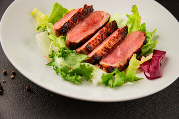 Duck breast roast poultry fresh natural product tasty snack delicious gourmet food background on the table rustic top view copy space