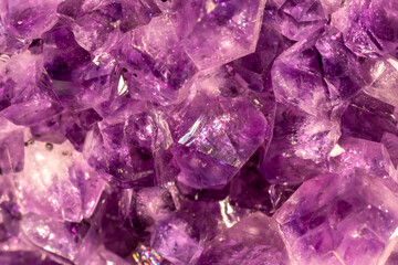 Amethyst purple crystals. Gems. Mineral crystals in the natural environment. Texture of precious...