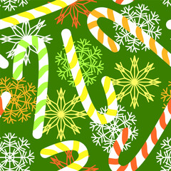 Seamless Christmas pattern with colorful sugar canes and snowflakes on a green background