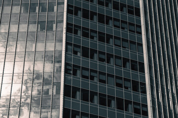 mirrored windows of the facade of an office building	
