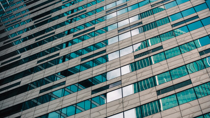 mirrored windows of the facade of an office building	