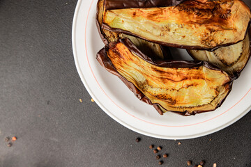 Baked eggplant grilled vegetables fresh natural product tasty snack delicious gourmet food background on the table rustic top view copy space keto and paleo diet vegan and vegan food
