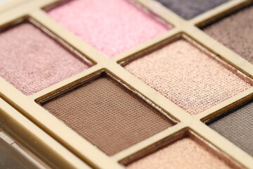Beautiful eyeshadow palette as background, closeup. Cosmetic product