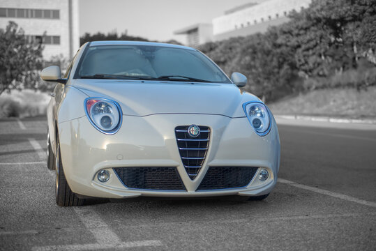 Airport City, Israel &ndash; 2025.09.26: White Alfa Romeo MiTo T-Jet side frontal view