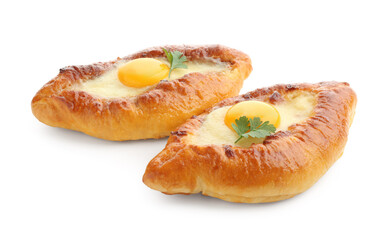 Tasty khachapuris with cheese, eggs and parsley isolated on white